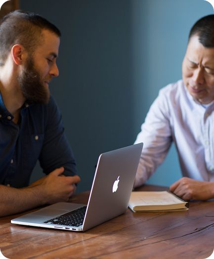 built mighty team at conference table discussing custom website development